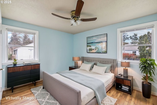 7515 SE Luther Rd, Portland, OR 97206 - bedroom with light wood finished floors, baseboards, and ceiling fan