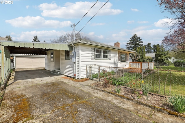 7515 SE Luther Rd, Portland, OR 97206 - view of front facade featuring driveway, a chimney, and an attached carport