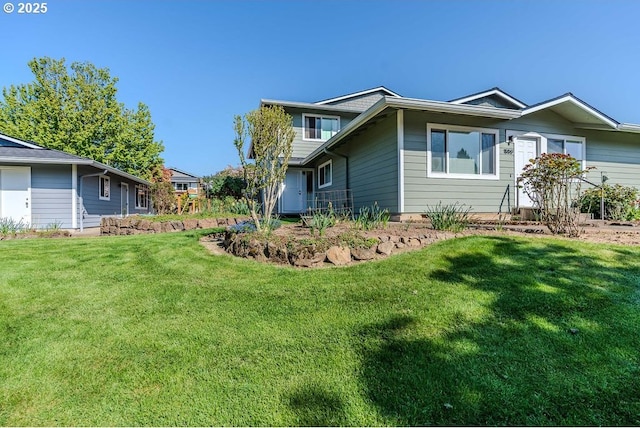 view of side of property featuring a yard