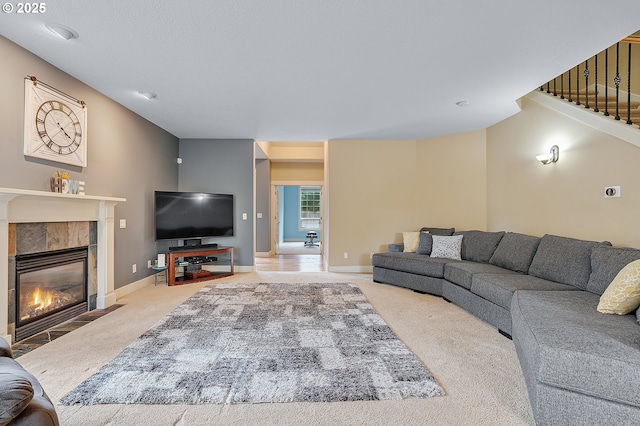 14386 NW Tripton Ct, Beaverton, OR 97006 - living area with carpet, a tile fireplace, and stairs