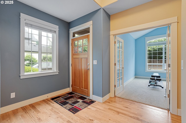 14386 NW Tripton Ct, Beaverton, OR 97006 - foyer entrance featuring wood finished floors and lofted ceiling