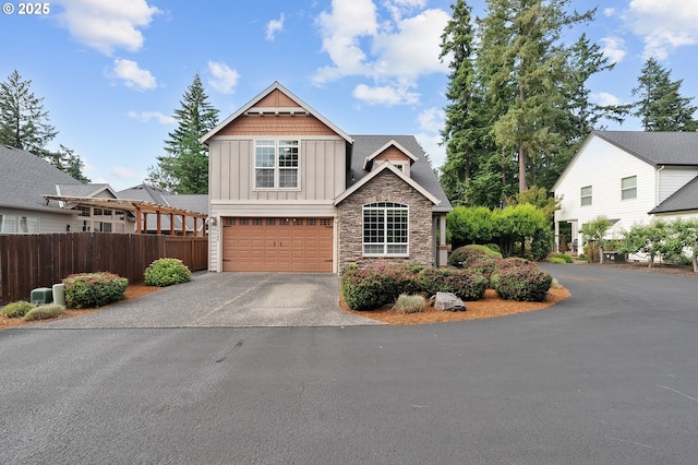 14386 NW Tripton Ct, Beaverton, OR 97006 - craftsman inspired home featuring board and batten siding, asphalt driveway, stone siding, and a garage