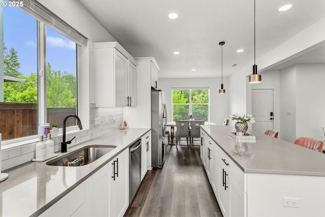 837 S 26th Ave, Cornelius, OR 97113 - kitchen with stainless steel appliances, a center island, recessed lighting, dark wood finished floors, and white cabinetry