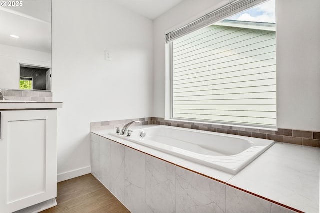 837 S 26th Ave, Cornelius, OR 97113 - bathroom featuring a garden tub, wood finished floors, and vanity