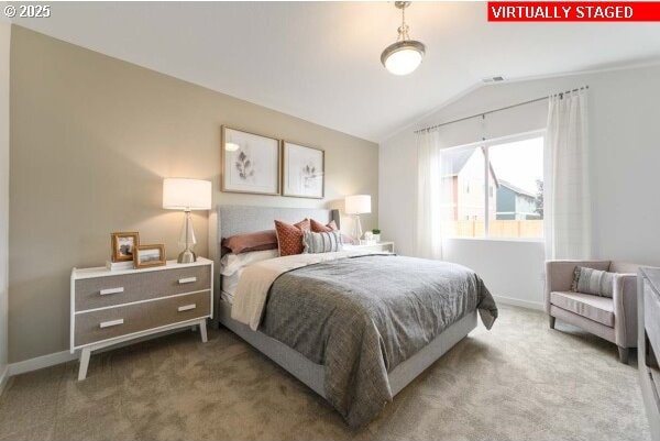 carpeted bedroom featuring vaulted ceiling and baseboards