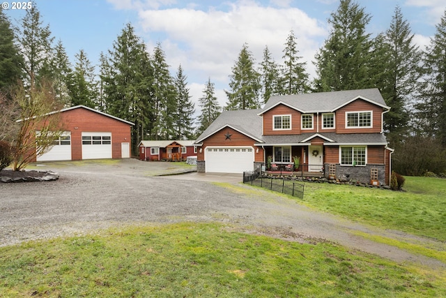 view of front of house featuring a garage, stone siding, a porch, and a front lawn