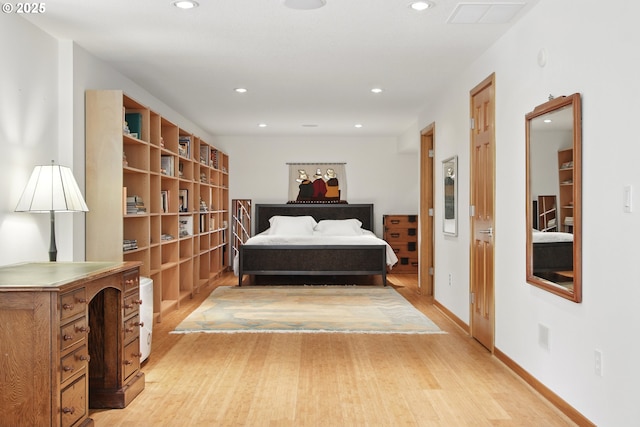 bedroom with recessed lighting, baseboards, and light wood-style flooring
