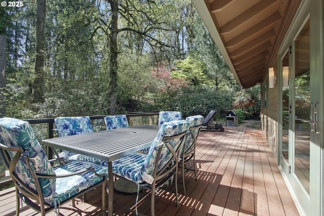 wooden deck with outdoor dining space