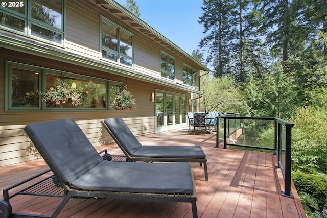 wooden terrace featuring outdoor dining area