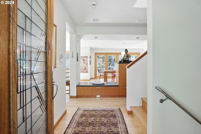 interior space with stairs, recessed lighting, and light wood-style flooring