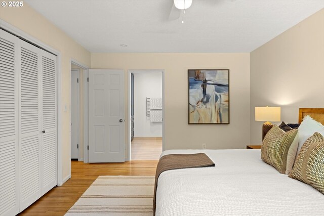 2395 SW Timberline Dr, Portland, OR 97225 - bedroom featuring light wood finished floors, a closet, and a ceiling fan