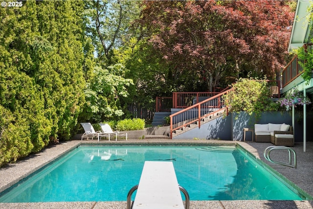 2395 SW Timberline Dr, Portland, OR 97225 - view of swimming pool with stairway, an outdoor living space, a diving board, and a deck
