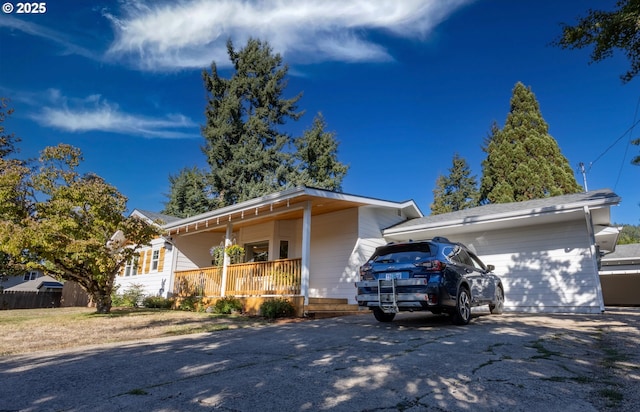 single story home featuring covered porch