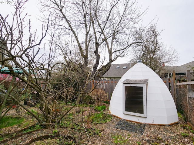 view of shed with a fenced backyard