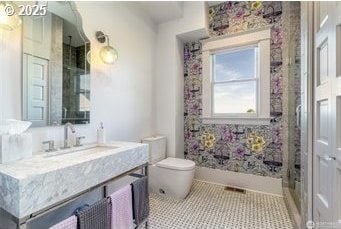53139 Appleton Rd, Milton-Freewater, OR 97862 - full bathroom featuring vanity, toilet, a shower, and baseboards
