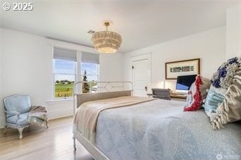 53139 Appleton Rd, Milton-Freewater, OR 97862 - bedroom with a chandelier and wood finished floors