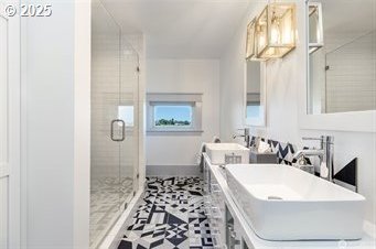 53139 Appleton Rd, Milton-Freewater, OR 97862 - full bathroom with a stall shower, double vanity, and baseboards
