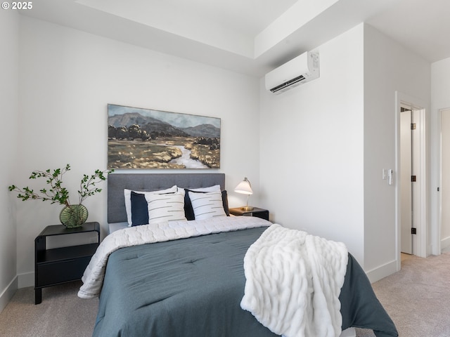 carpeted bedroom featuring an AC wall unit and baseboards