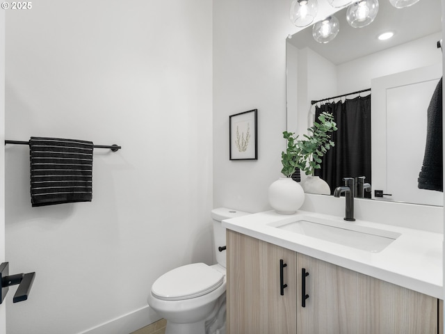 bathroom with vanity and toilet