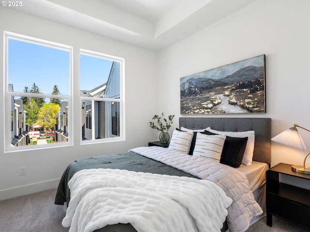 carpeted bedroom with baseboards