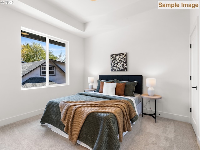 bedroom with baseboards and carpet floors