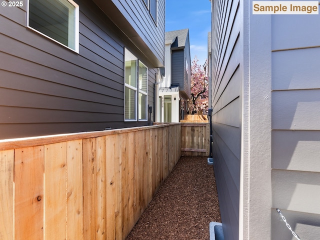 view of side of property with fence