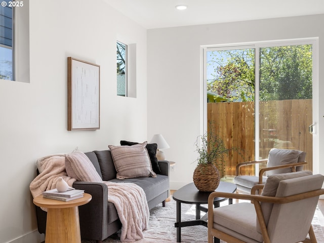sitting room featuring baseboards and recessed lighting