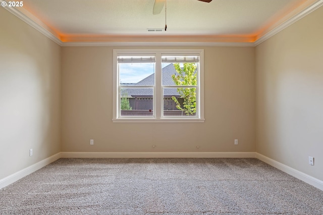 unfurnished room with carpet, ornamental molding, a ceiling fan, and baseboards