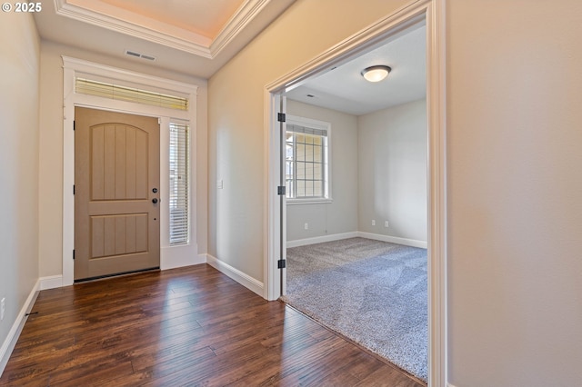 foyer entrance with dark wood-style floors and baseboards