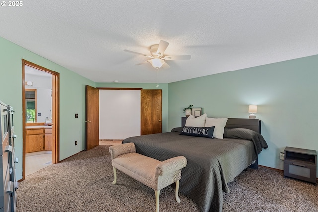 7215 NE Par Ln, Vancouver, WA 98662 - carpeted bedroom featuring a textured ceiling, a ceiling fan, and ensuite bathroom