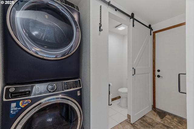 7215 NE Par Ln, Vancouver, WA 98662 - laundry area with a barn door and stacked washer and clothes dryer