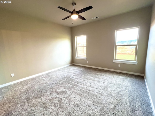 947 Medina Ave, Sutherlin, OR 97479 - carpeted spare room with visible vents, ceiling fan, and baseboards