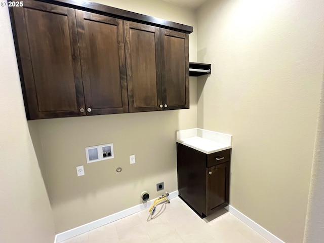 947 Medina Ave, Sutherlin, OR 97479 - laundry room with baseboards, washer hookup, gas dryer hookup, hookup for an electric dryer, and cabinet space