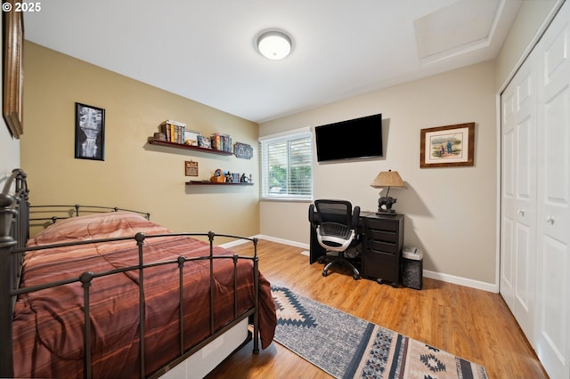 17622 NW Rolling Hill Ln, Beaverton, OR 97006 - bedroom featuring a closet, wood finished floors, baseboards, and attic access