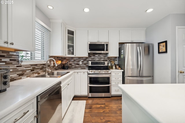 17622 NW Rolling Hill Ln, Beaverton, OR 97006 - kitchen with appliances with stainless steel finishes, a sink, light countertops, tasteful backsplash, and recessed lighting
