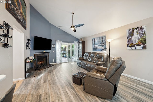 17622 NW Rolling Hill Ln, Beaverton, OR 97006 - living area with a ceiling fan, high vaulted ceiling, wood finished floors, a fireplace, and baseboards