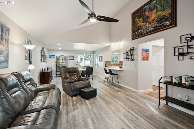 17622 NW Rolling Hill Ln, Beaverton, OR 97006 - living area with ceiling fan, light wood finished floors, high vaulted ceiling, recessed lighting, and baseboards