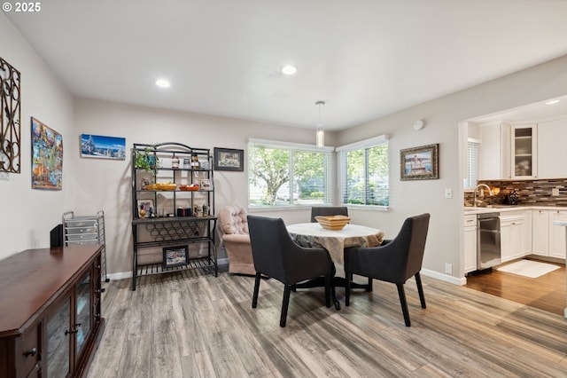 17622 NW Rolling Hill Ln, Beaverton, OR 97006 - dining area featuring light wood-type flooring, recessed lighting, and baseboards