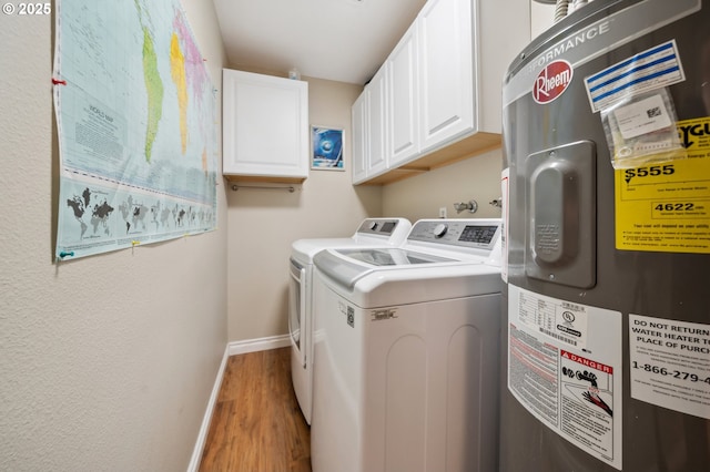 17622 NW Rolling Hill Ln, Beaverton, OR 97006 - laundry room with electric water heater, cabinet space, wood finished floors, baseboards, and washer and clothes dryer