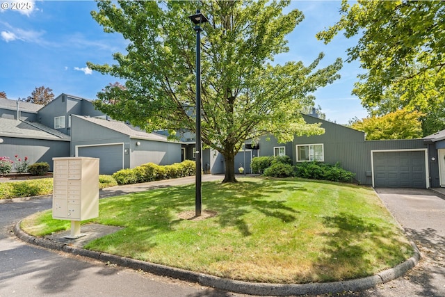 17622 NW Rolling Hill Ln, Beaverton, OR 97006 - mid-century modern home featuring a front yard, a garage, and driveway