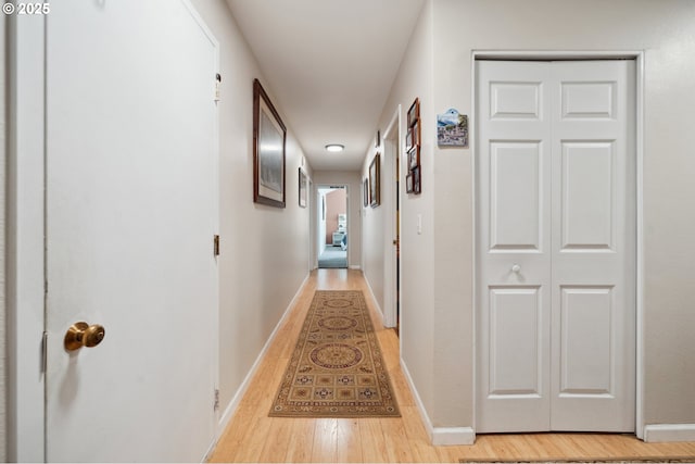 17622 NW Rolling Hill Ln, Beaverton, OR 97006 - hallway featuring light wood-type flooring and baseboards