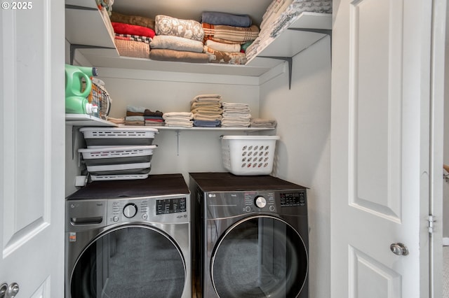 clothes washing area featuring laundry area and independent washer and dryer