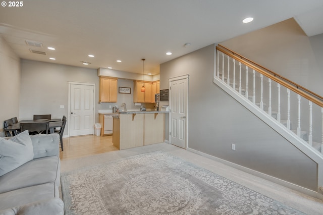 living room featuring stairs, baseboards, visible vents, and recessed lighting