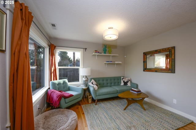 interior space with light hardwood / wood-style flooring and a textured ceiling