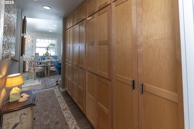 hall featuring recessed lighting and wood finished floors