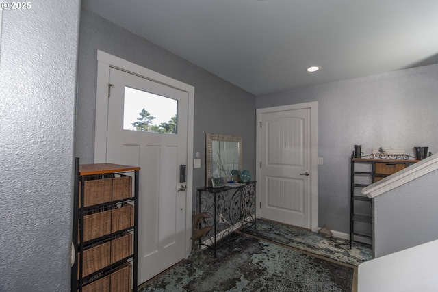 carpeted entrance foyer featuring recessed lighting