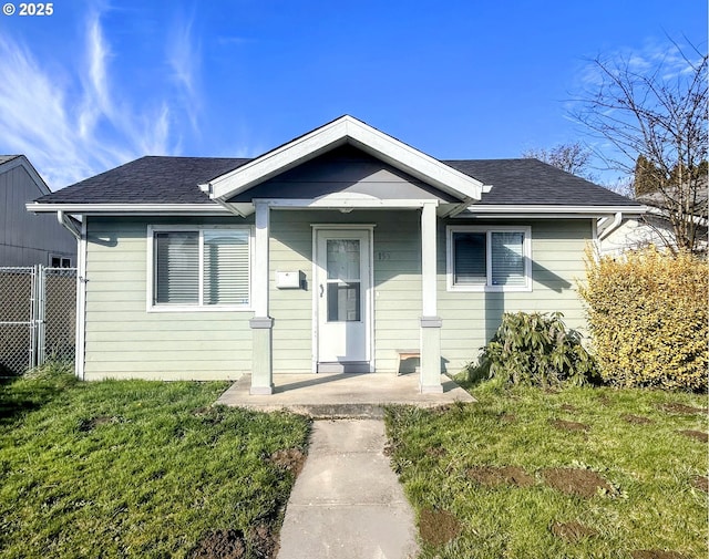 bungalow-style house with a front yard