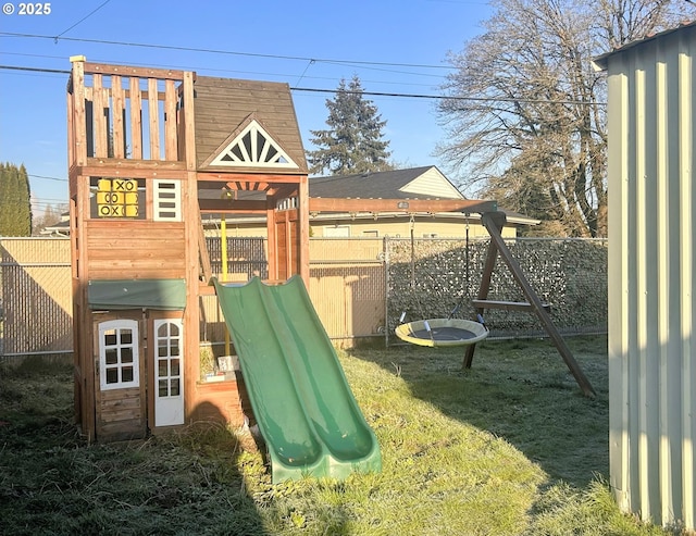 view of jungle gym with a lawn