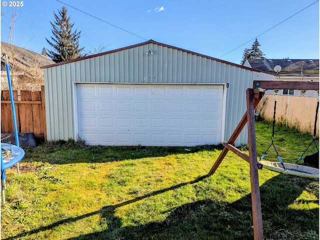 garage featuring a yard