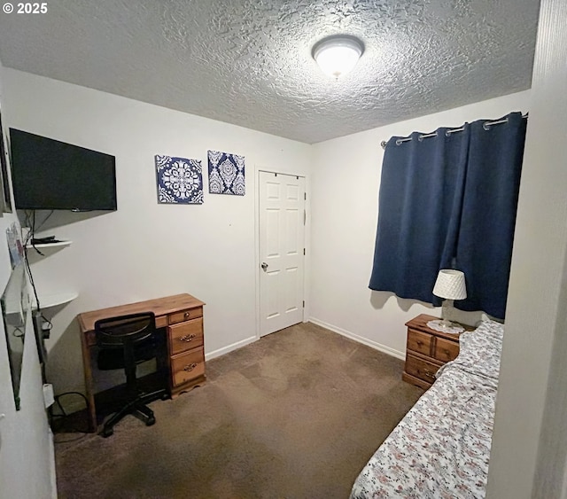 carpeted bedroom featuring a textured ceiling